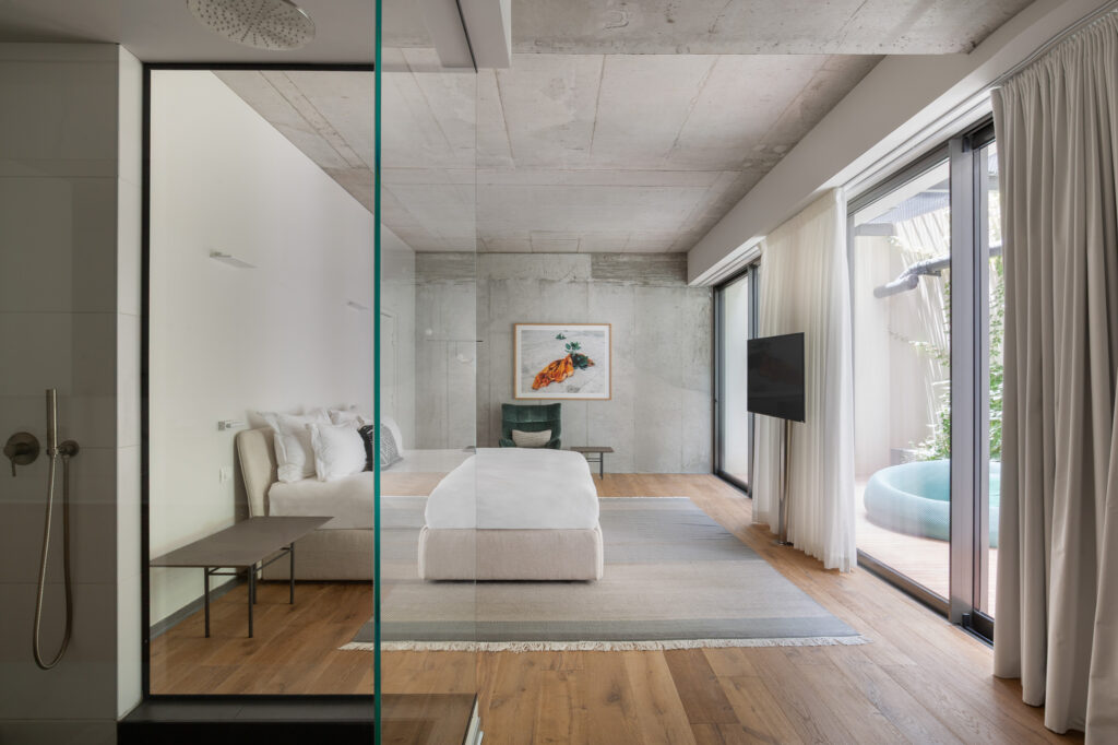 Luxury bedroom interior at The Levee Neve Tzedek, blending historic architecture with contemporary sophistication. Design by Yael Siso.
